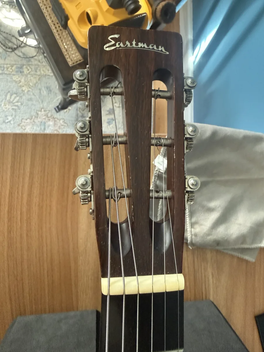 Slotted headstock and nut of an Eastman E20 OO during setup and inspection